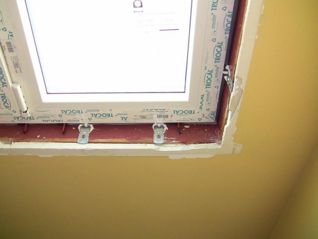 Securely attaching a window to the frame